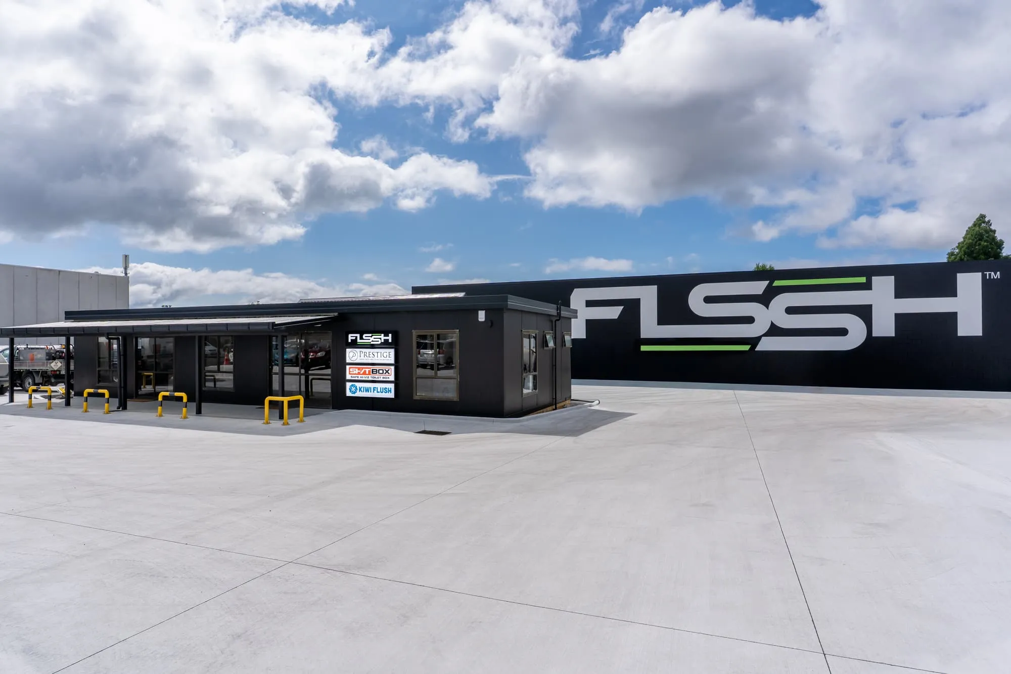 FLSSH's Henderson HQ: the office and the big FLSSH sign on the yard wall